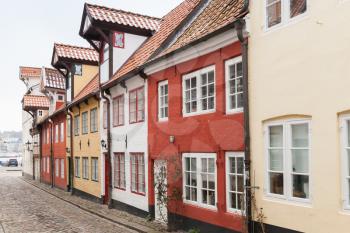 Colorful houses in a row along the street in old town of Flensburg, Germany
