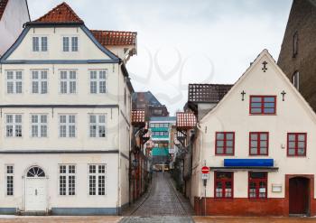 Street view with traditional colorful living houses of Flensburg, Germany