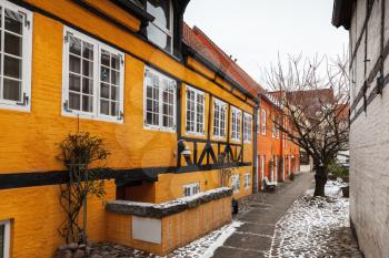 Traditional colorful living houses along narrow street in old town of Flensburg, Germany