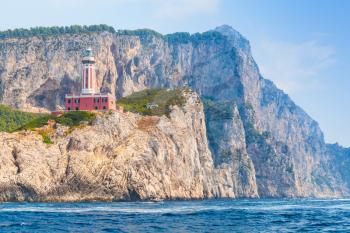 Punta Carena. Lighthouse stands on the rocky coast of Capri island, Italy