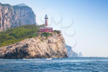 Punta Carena. Lighthouse tower stands on the rocky coast of Capri island, Italy