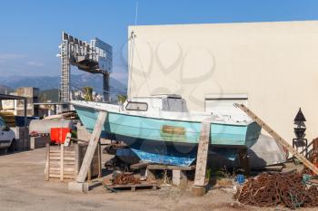 Old wooden yacht repairing, port of Ajaccio, Corsica, France