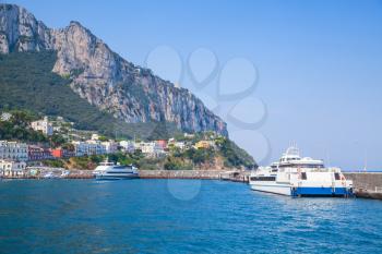 Main port of Capri island, Italy. Passenger ferries moored in harbor