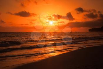 Bright red sunrise over Atlantic ocean. Dominican republic, Punta Cana beach