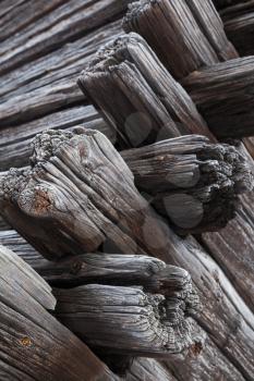 Corner wooden construction, old dark wooden house made of logs