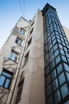External lift shaft made of glass and steel. It was added for many living houses in old part of Saint-Petersburg, Russia