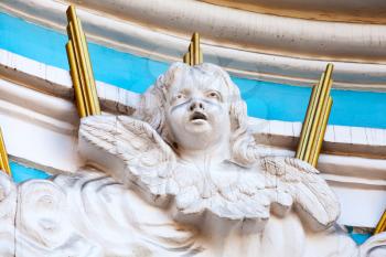 Decoration details of Orthodox St. Nicholas Naval Cathedral facade in St. Petersburg, Russia, angel sculptural portrait. 