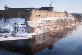 Ivangorod fortress at Narva river in winter season. Border between Russia and Estonia