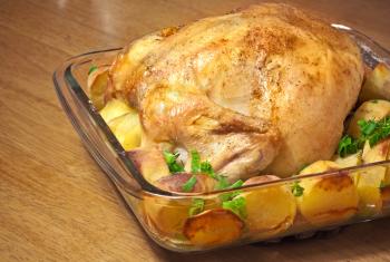 Whole chicken baked with potatoes