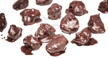 Homemade prunes in chocolate candies on white background