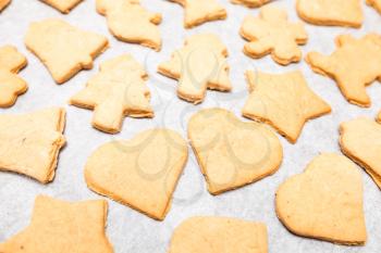Simple homemade Christmas cookies on a white cooking paper