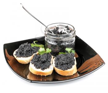 Sandwiches with black caviar on plate isolated on white
