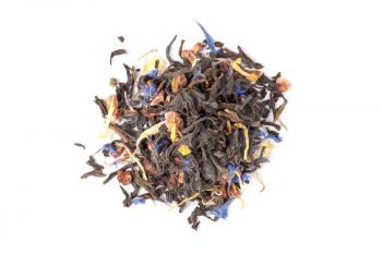 Small pile of big leaf black tea mixed with herbs and dry fruits. Calendula, sunflower, cornflower, rosehip berries. Top view, selective focus