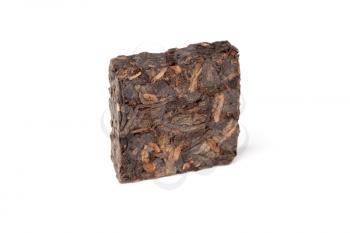 Small pressing square briquette of black Chinese Shu Pu-erh tea isolated on white background