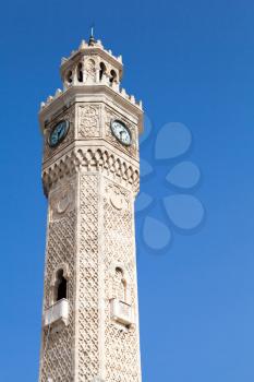 Historical clock tower over blue sky, it was built in 1901 and accepted as the official symbol of Izmir City, Turkey