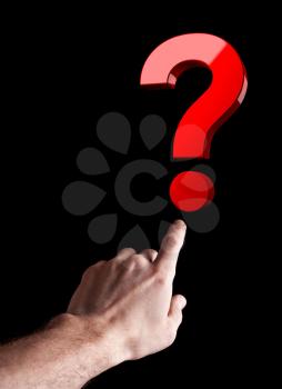 Man's hand shows big red question sign isolated on black background