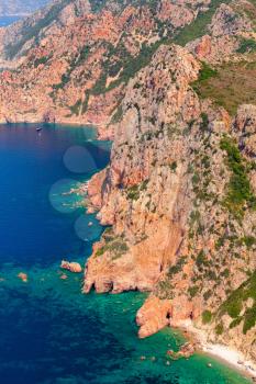Corsica, French island in Mediterranean Sea. Vertical coastal landscape with rocks, bird eye view. Gulf of Porto, view from Capo Rosso