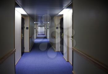 Abstract dark hotel corridor interior with doors and room numbers