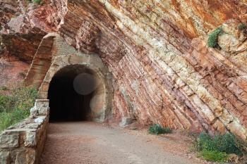 Old tunnel entrance in red rock