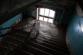 Dark abandoned stairway interior in old living house, St.Petersburg, Russia
