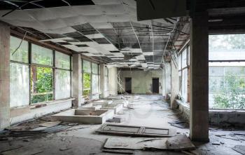 Abandoned building interior. Hall perspective with dirt on the floor