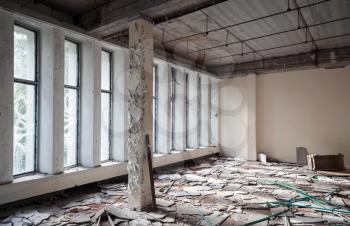 Abandoned industrial building interior. Concrete walls and columns