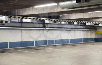 Empty underground parking interior, concrete walls and floor