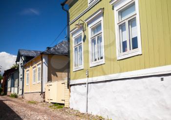 Street view of historical Finnish town Porvoo, facades of wooden living houses