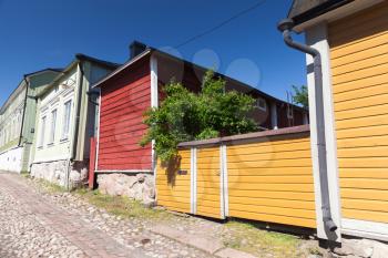 Street view of historical Finnish town Porvoo, colorful facades of wooden living houses