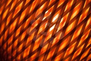 Abstract red background with macro of wicker lampshade