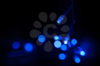 Blue LED (light emitting diodes) lights garland on black background