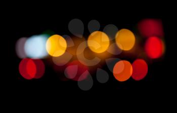 Abstract photo with colorful lights bokeh pattern on black background