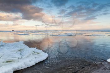 Winter coastal landscape with ice and snow on the beach. Gulf of Finland, Baltic Sea