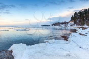 Winter coastal landscape with ice and snow on the beach. Gulf of Finland, Russia