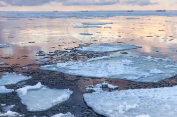 Winter coastal landscape with big floating ice fragments. Gulf of Finland, Russia