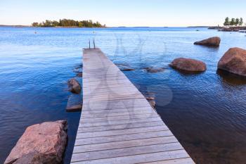 Wooden pier perspective, Saimaa lake landscape, Finland