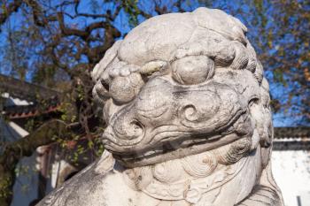 Ancient Chinese lion statue made of white stone