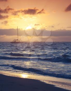 Colorful sunrise over Atlantic ocean. Dominican republic, Punta Cana resort beach. Tonal correction photo filter effect