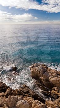 France, Nice, breaking waves with rocks