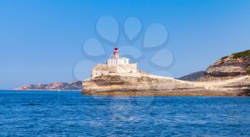Madonetta lighthouse tower. Entrance to Bonifacio port, France. Mountainous Mediterranean island Corsica, Corse-du-Sud