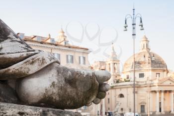 Dirty human leg, Fragment of ancient sculpture on the Piazza del Popolo square, old city center of Rome, Italy