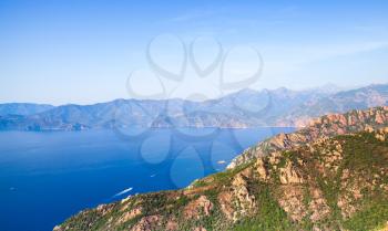 Rocks and sea in summer time. Coastal landscape of French mountainous Mediterranean island Corsica. Corse-du-Sud, Piana region