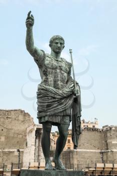 Ancient statue S.P.Q.R. IMP CAESAR Augustus PATRIAE PATER. Via dei Fori Imperiali street, Rome, Italy