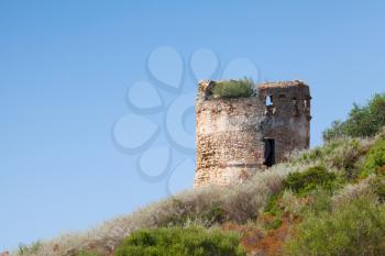 Old ruined stone fort tower in Piana region. Corsica island, France