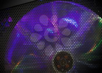 Computer case fragment. Rotating fan cooler with colorful LED illumination
