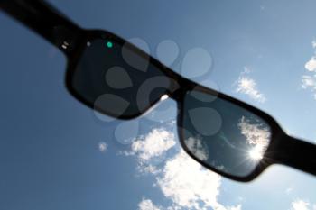 Sun is shining through modern sunglasses