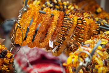 Amber beads and bracelets on the counter. Riga, Latvia