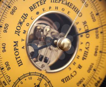 Closeup fragment of vintage yellow Russian barometer 