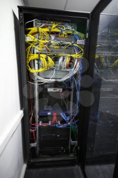 Modern black server cabinet with network equipment and wires