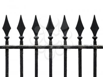 Old cast iron fence with spears isolated on white. Seamless fragment